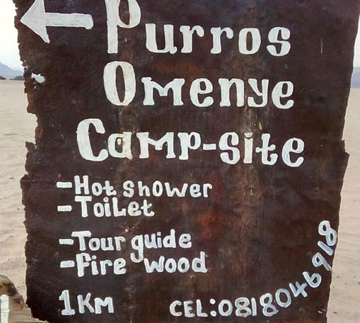 Signpost, Omenye campsite, Puros